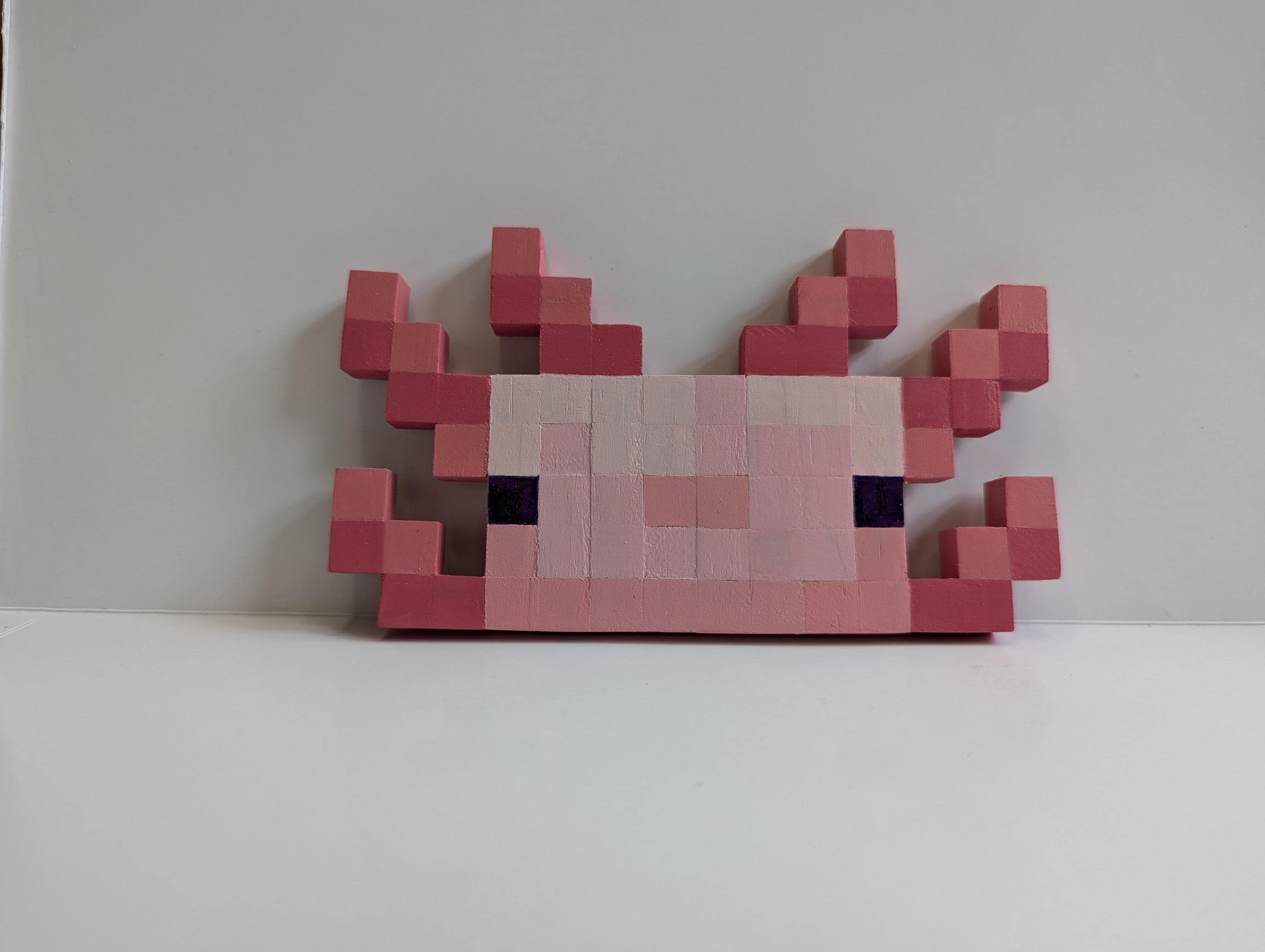 Wooden block Minecraft inspired hand painted Axolotl face.