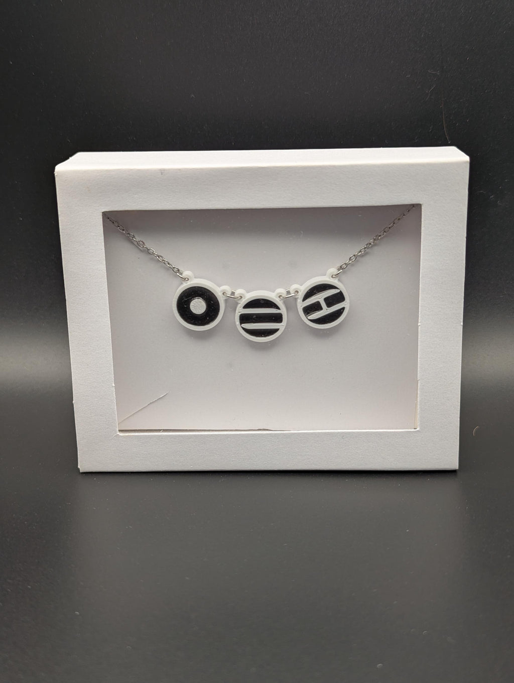 Arirang inspired Necklace ~ Three 3D printed symbols inlaid with resin on an 18 inch Stainless steel chain.