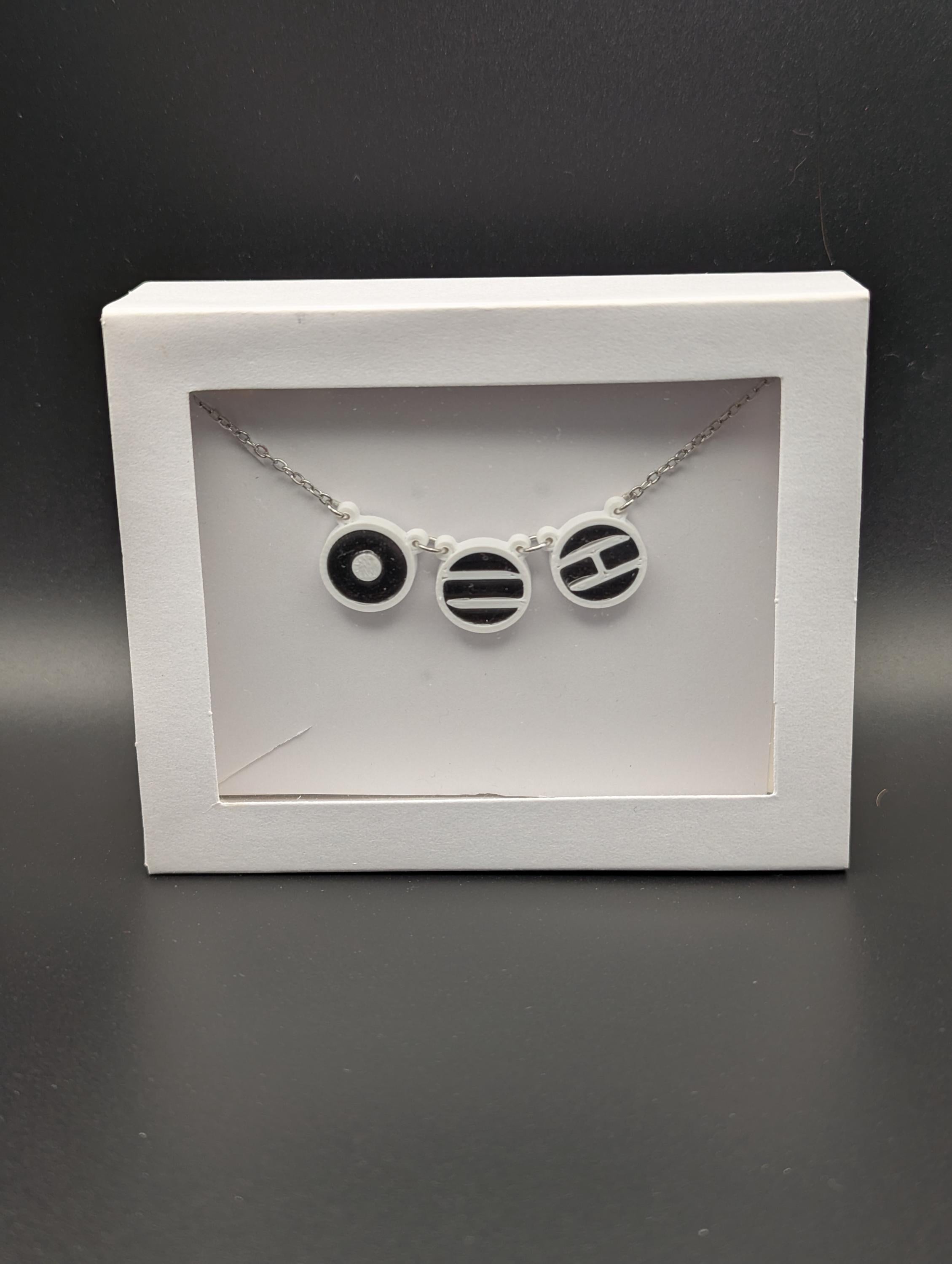 Arirang inspired Necklace ~ Three 3D printed symbols inlaid with resin on an 18 inch Stainless steel chain.