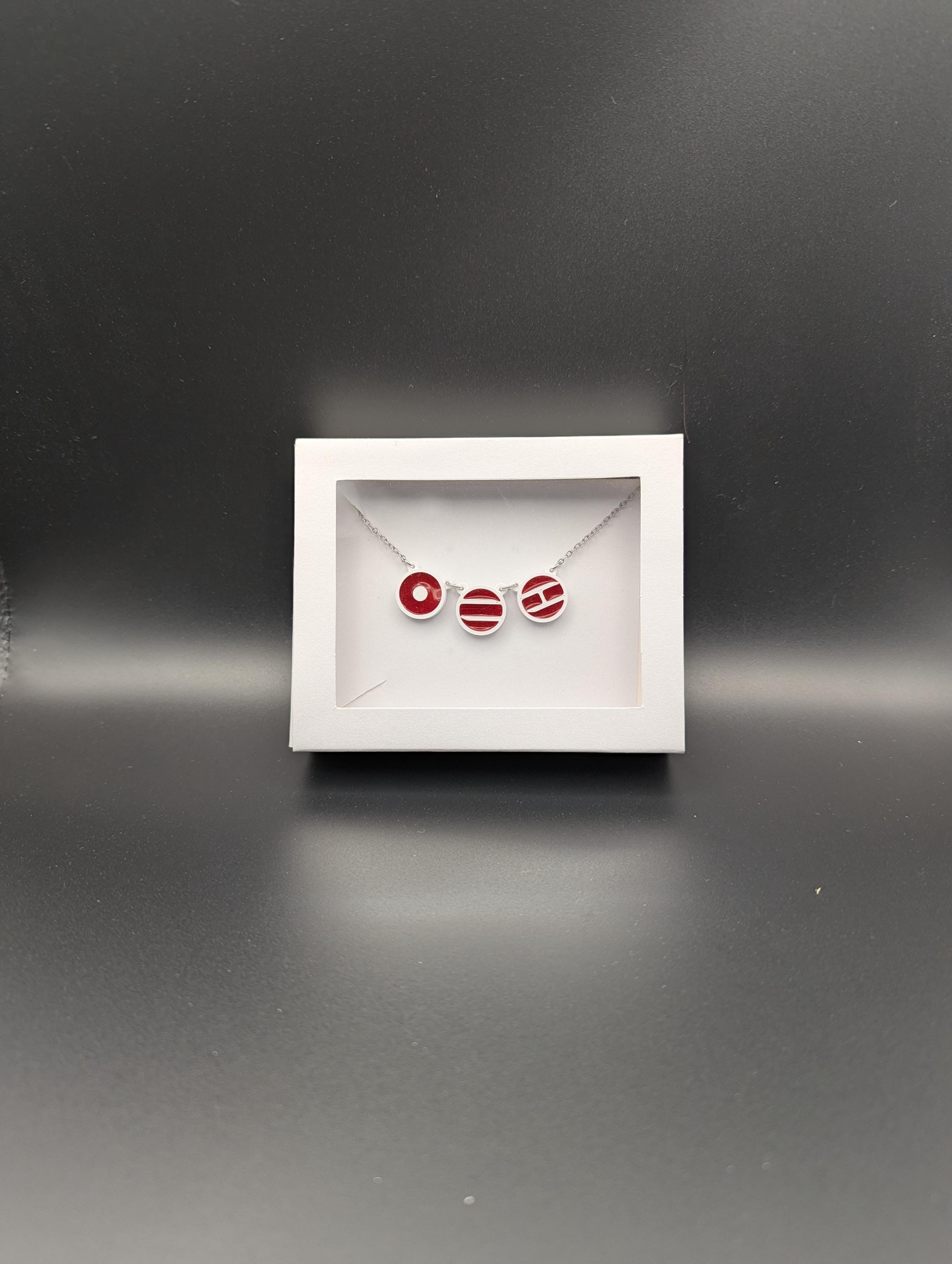 Arirang inspired Necklace ~ Three 3D printed symbols inlaid with resin on an 18 inch Stainless steel chain.